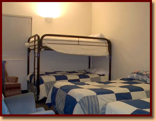 Bedroom with lots of beds